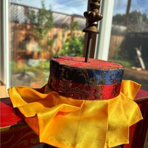 Vibrant Red and Blue Decorative Accent with Yellow Trim